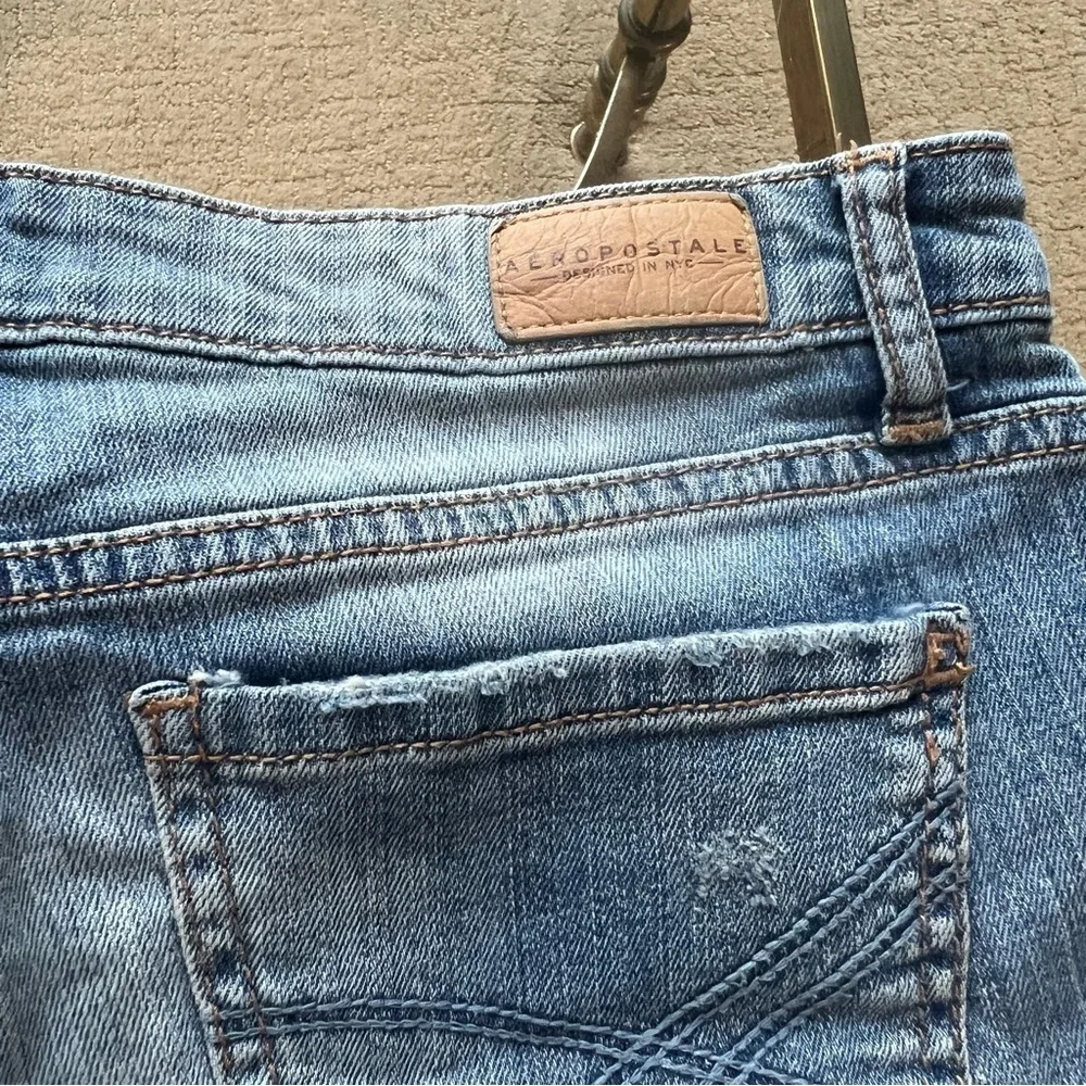 Distressed denim shorts.